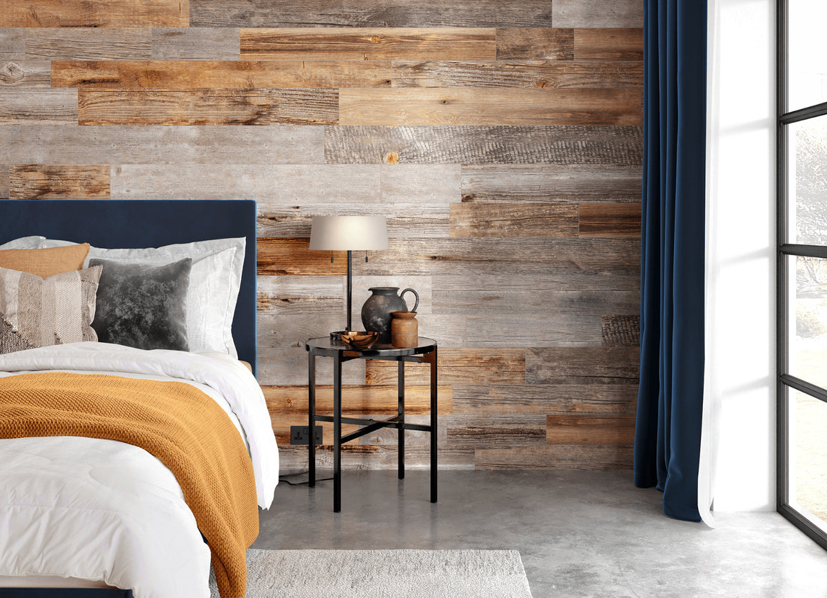 Naturewall Reclaimed Planks in Grey Pine and Natural Pine. Bed and bed side table in foreground. Natural light coming through a large window on the right.