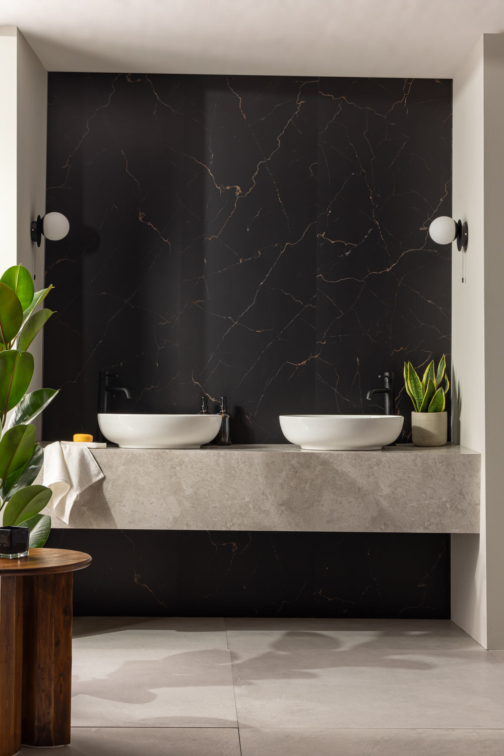 Elemence Shower Panels Marquina Black on wall behind two wash basins and plants in bathroom setting